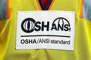 OSHA-compliant label on a high-visibility safety vest